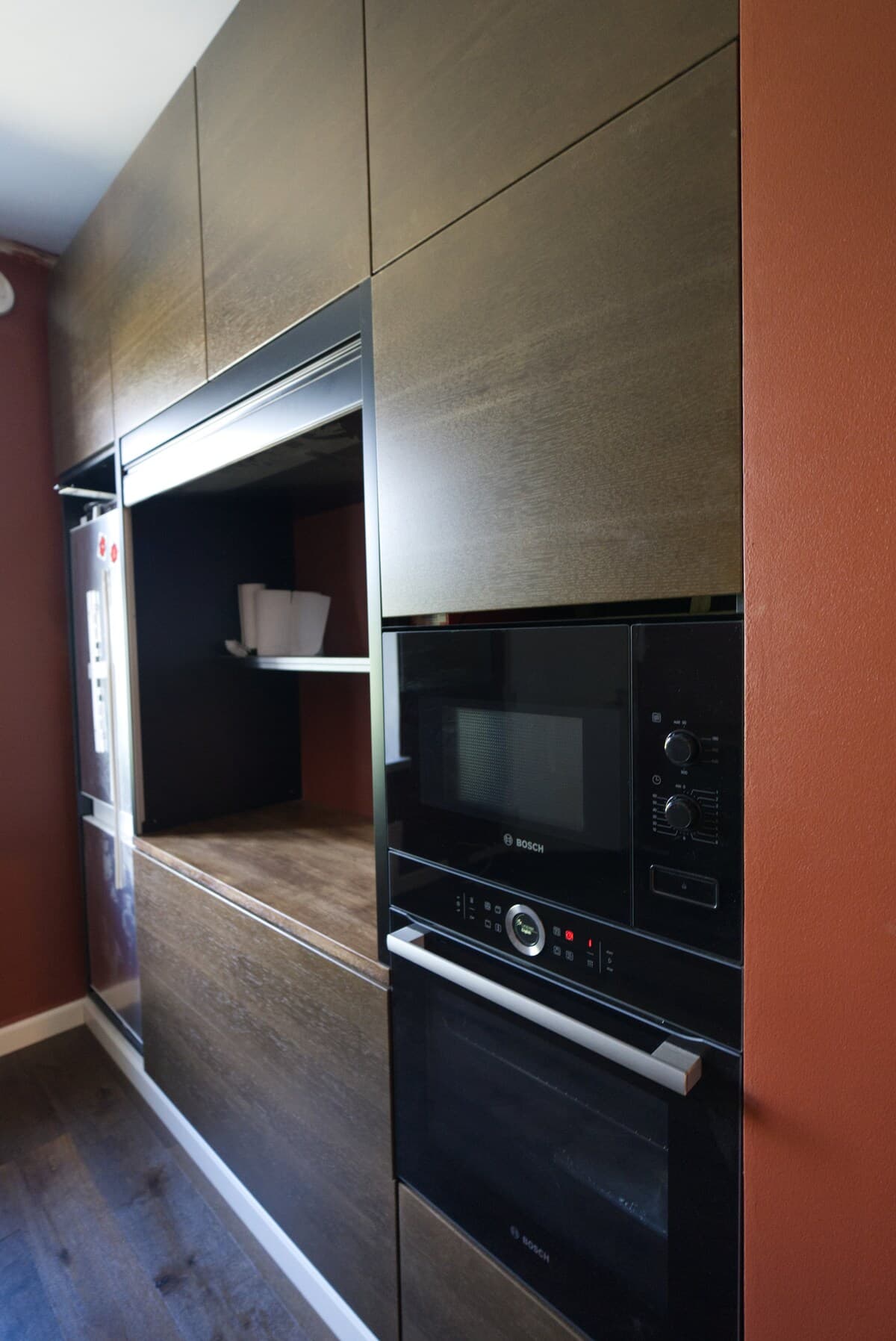 Built-in Bosch oven and microwave in dark cabinetry